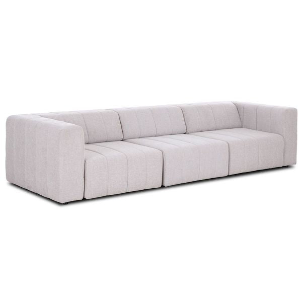 Sofa narozna o harmonijnych proporcjach z eleganckim profilem w odcieniu bieli