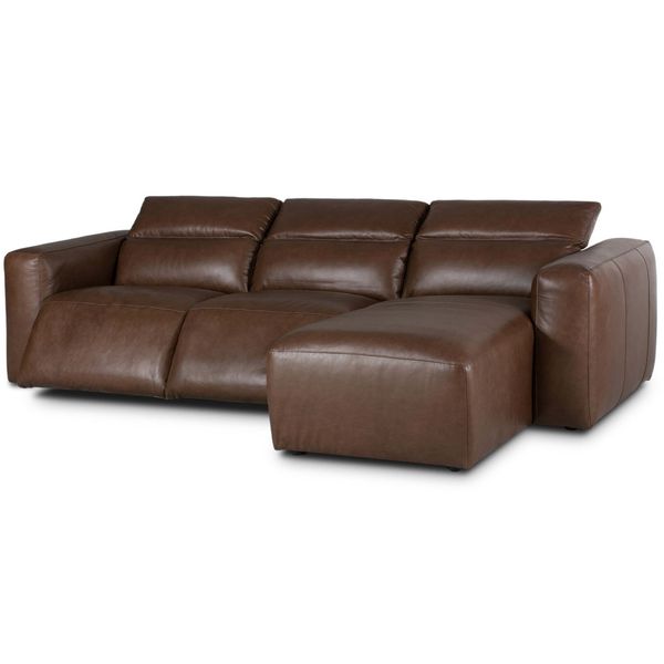 Sofa narozna o spokojnej linii z dopracowana sylwetka w odcieniu brazu